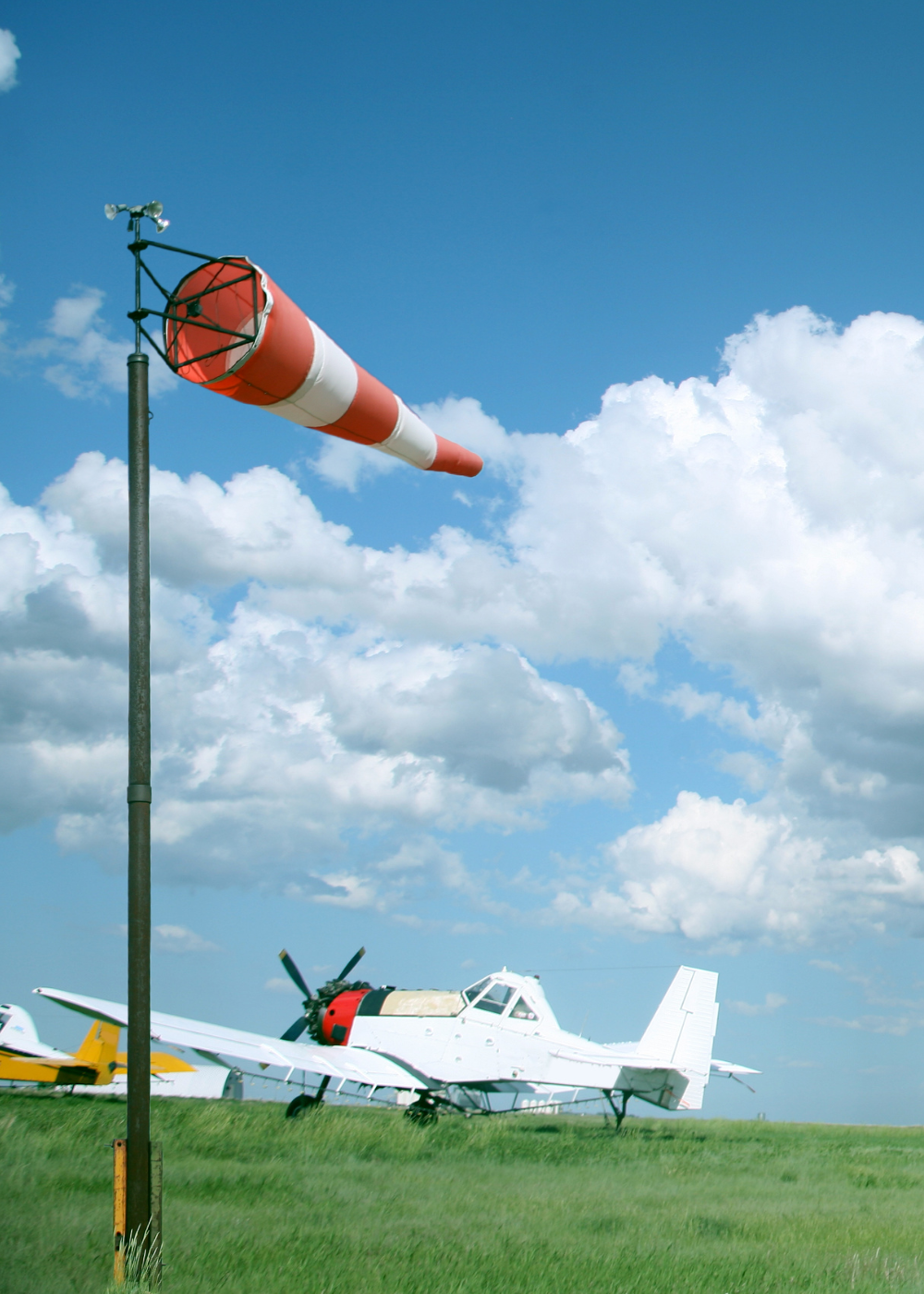 orange industrial windsocks and orange and white airport windsocks